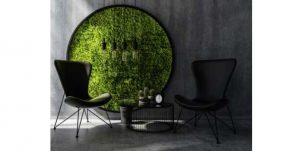 round grass circle with black chairs and table
