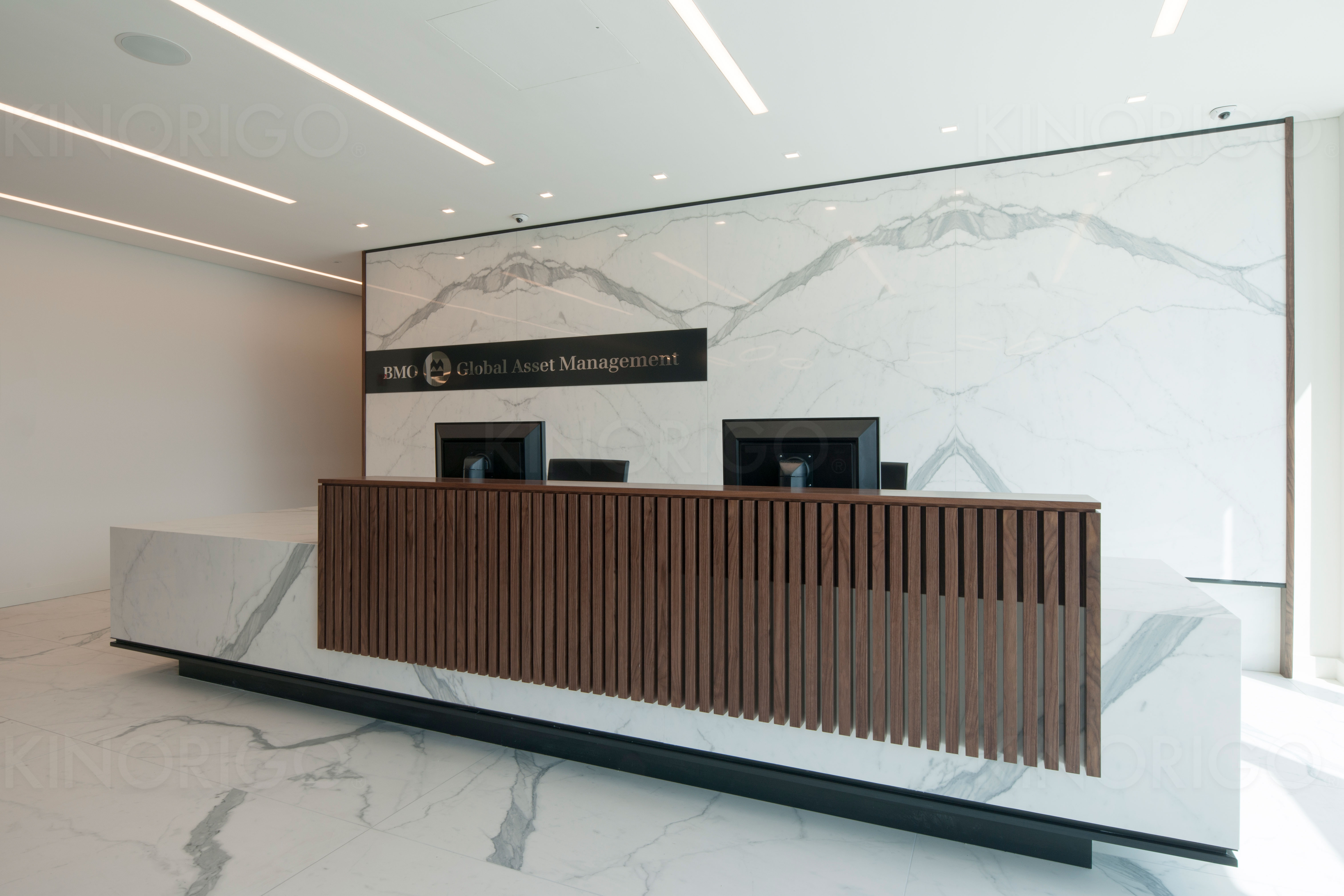 marble reception desk with wooden panels