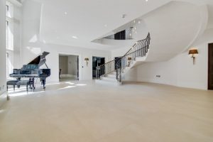 large entry area with porcelain floor and piano