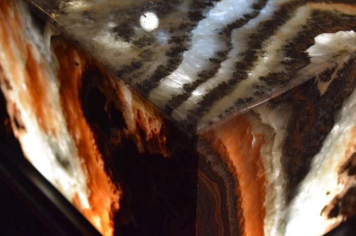corner close up of swirly marble in warm tones
