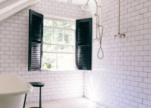white tile wet room with barn windows